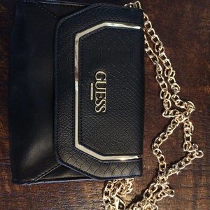 Small black Guess purse with golden chains straps